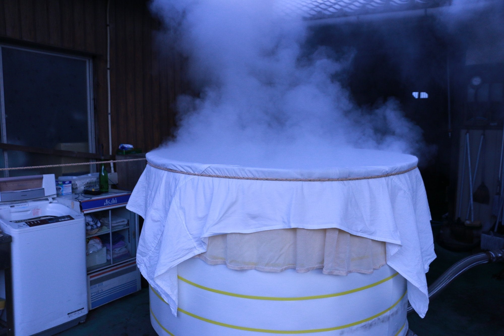 Steaming rice in the koshiki at Kankoubai Sake Brewery